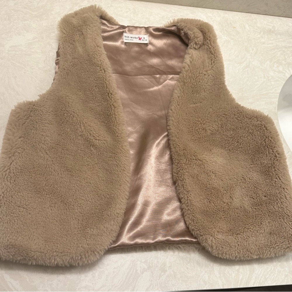 Light brown color.   Matches with anything especially jeans